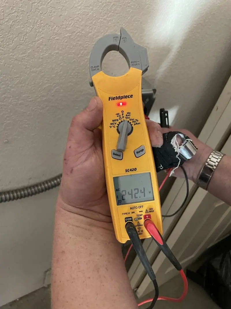 Voltage testing with clamp meter during Outlet Installation in Saddle Brook